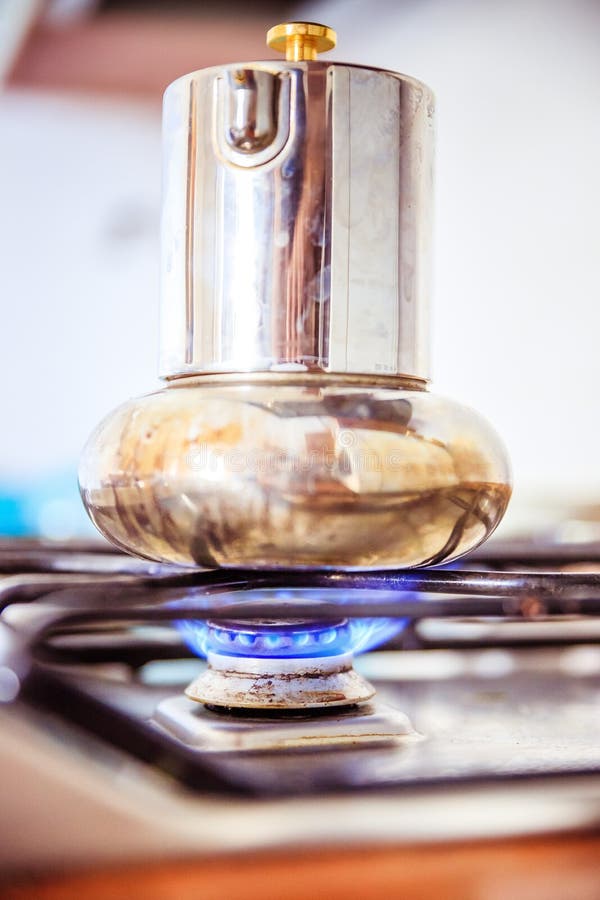 Italian coffe cooker on gas stove, breakfast royalty free stock photography Italian coffe cooker on gas stove, breakfast royalty free stock photography