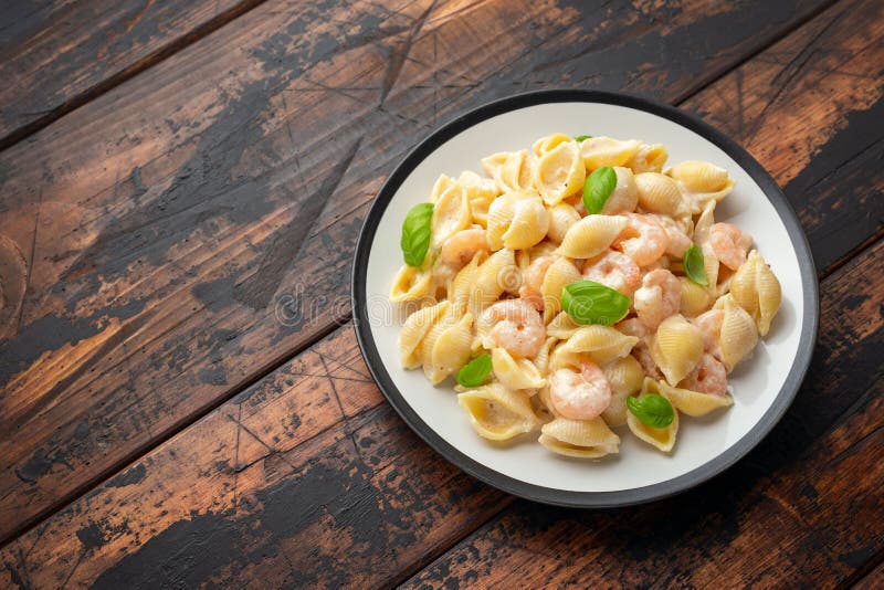Italian Conchiglie Prawn, Shrimp Pasta in a Creamy Sauce on Plate