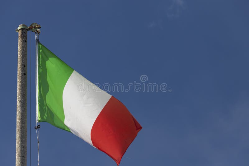 Italian Flag Blowing in the Wind in the Blue Sky Stock Photo Image of