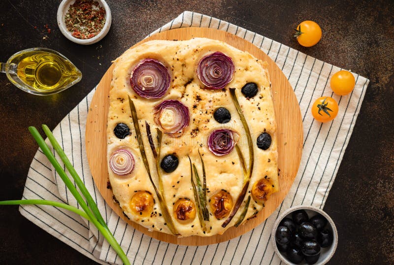 Italian focaccia bread with vegetables and herbs