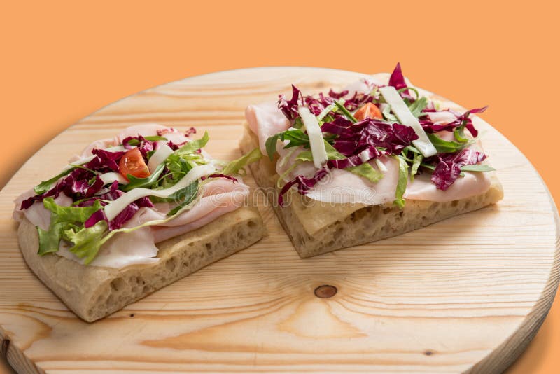 Italian focaccia with ham and lettuce salad royalty free stock images
