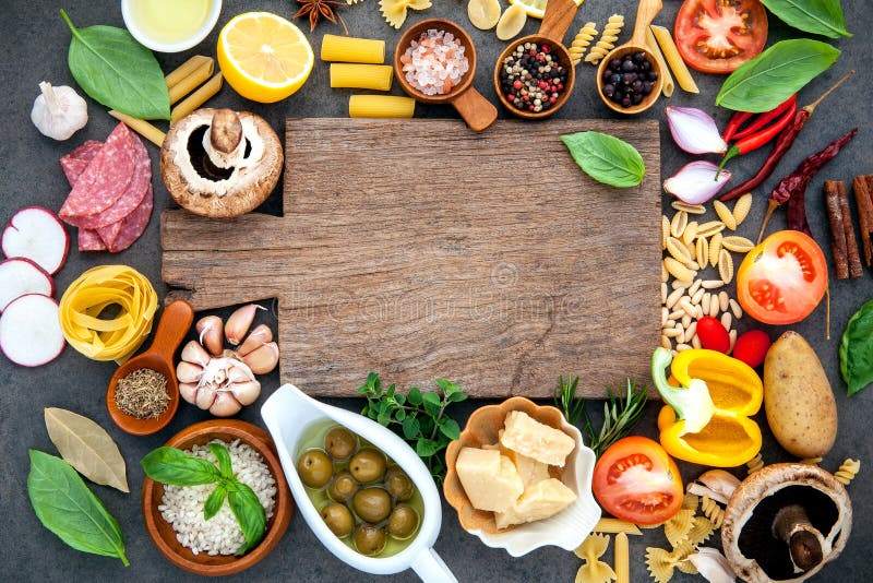Italian food cooking ingredients on dark stone background with c royalty free stock photos Italian food cooking ingredients on dark stone background with c royalty free stock photos