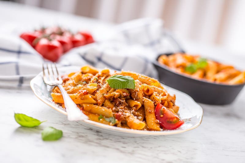 Italian food and pasta pene with bolognese sause on plate royalty free stock photo Italian food and pasta pene with bolognese sause on plate royalty free stock photo