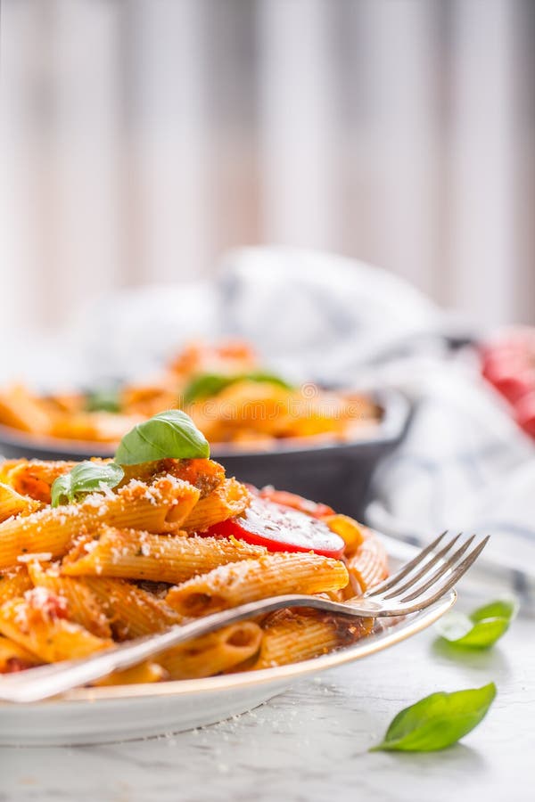 Italian food and pasta pene with bolognese sause on plate