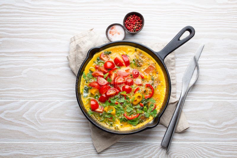 Italian frittata with eggs and vegetables stock images