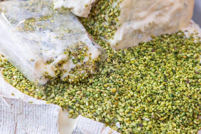 Italian gorgonzola cheese covered in crushed pistachios creamy texture contrasts with crunchy green nuts royalty free stock images