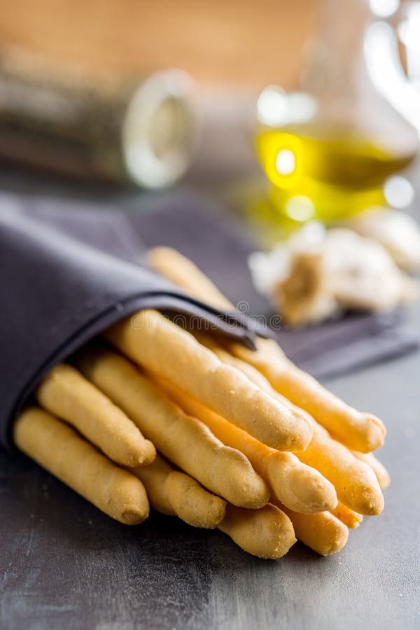 Italian Grissini Bread Sticks Seeds on Kitchen Table Stock Photo