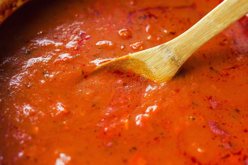 Marinara sauce being stirred by a wooden spoon. royalty free stock image Marinara sauce being stirred by a wooden spoon. royalty free stock image