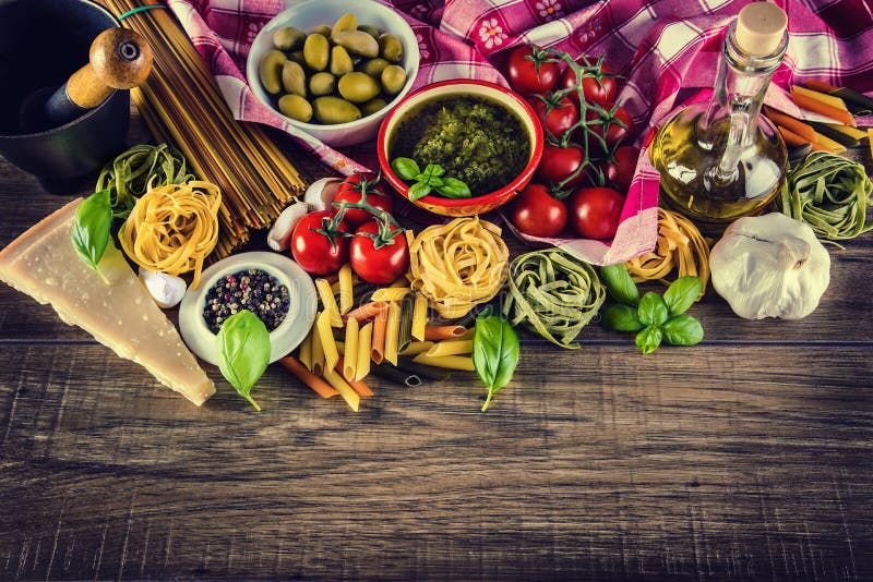 Italian and Mediterranean food ingredients on old wooden background.