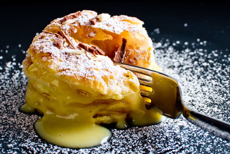 Italian Millefoglie pastry with custard on black dish