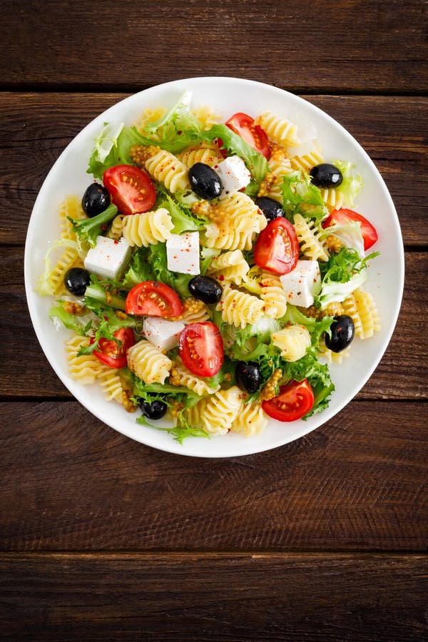 Italian Pasta Salad with Fresh Tomato, Cheese, Lettuce and Olives on