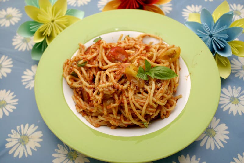 Some italian pasta with a sauce of tomatoes and basil. Italian pasta spaghett stock images, royalty-free photos and pictures