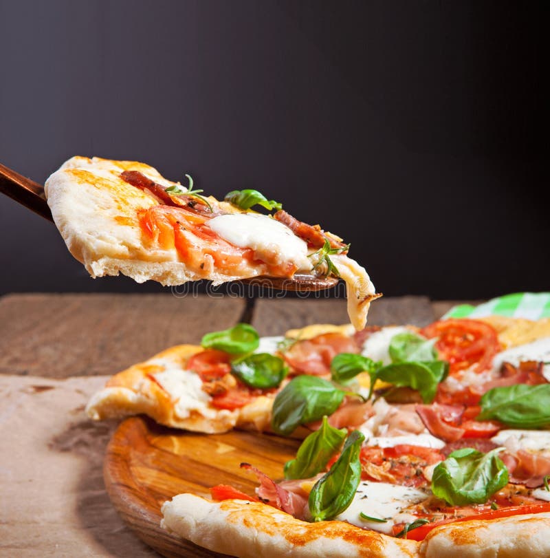 Italian pizza served on wooden table