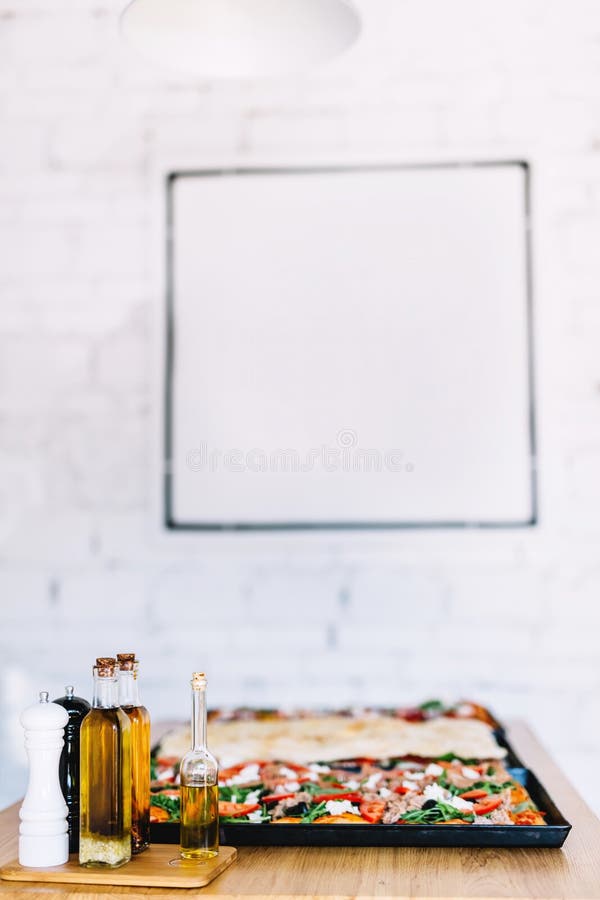 Italian pizza sicilian style with olive in restaurant stock images