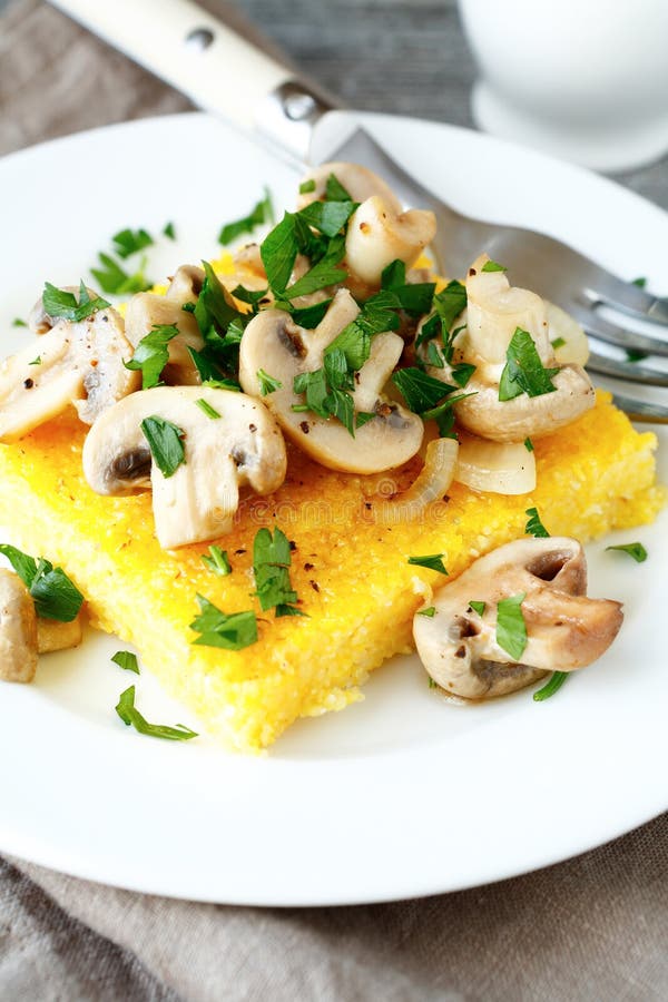 Italian Polenta with Champignons on a Plate Stock Photo - Image of ...