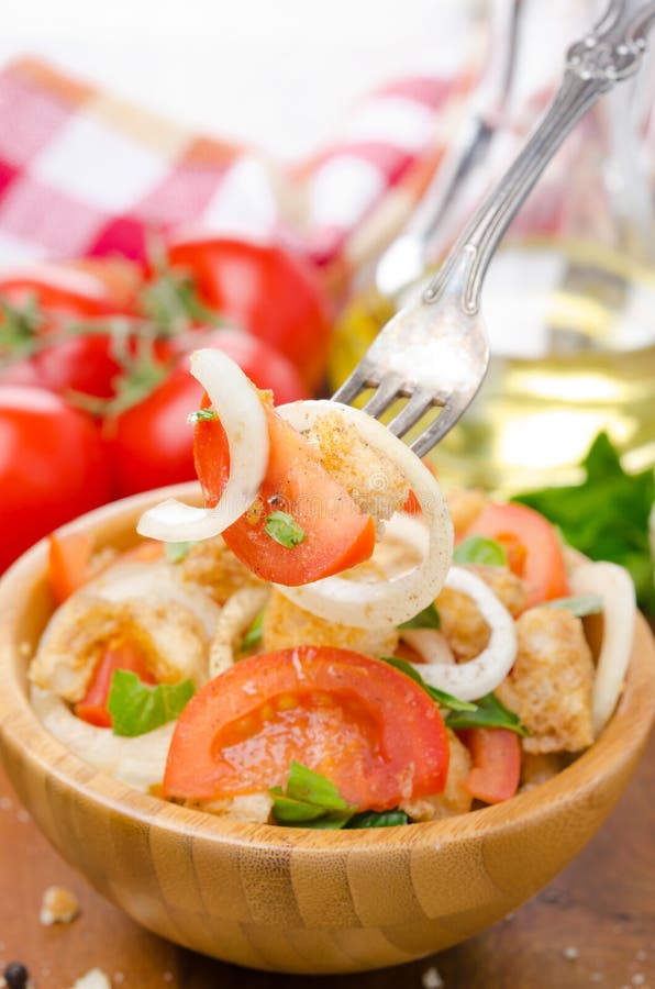 Italian salad panzanella with tomatoes, onions and croutons