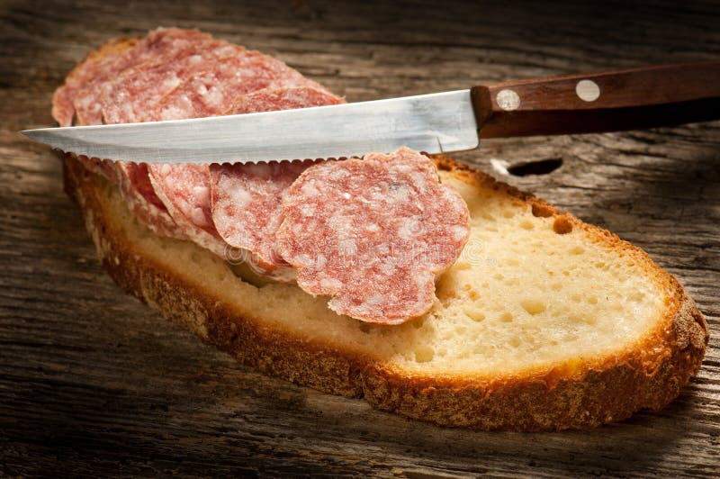Italian salami with slice bread royalty free stock photography