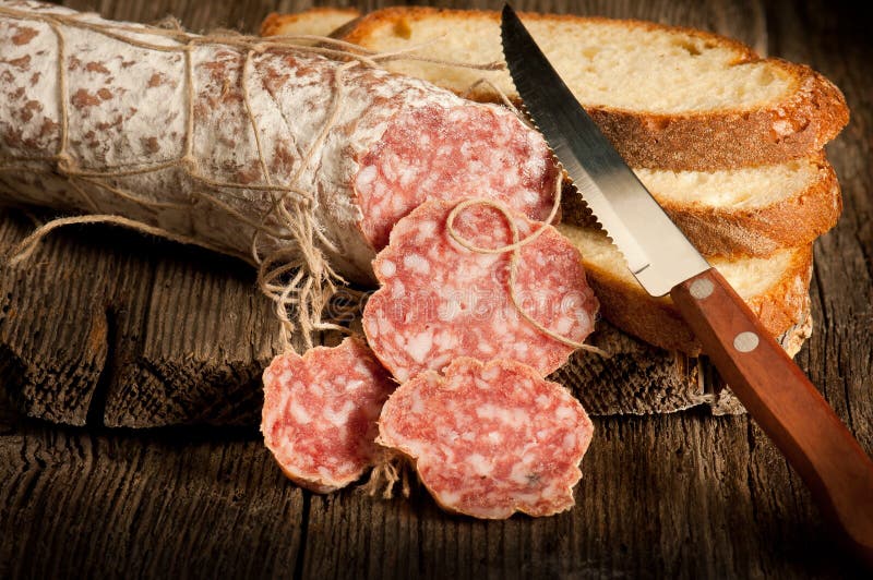Italian salami with slice bread stock photography