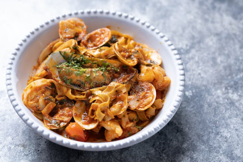 Italian Seafood Pasta in Tomato Sauce Stock Image - Image of food