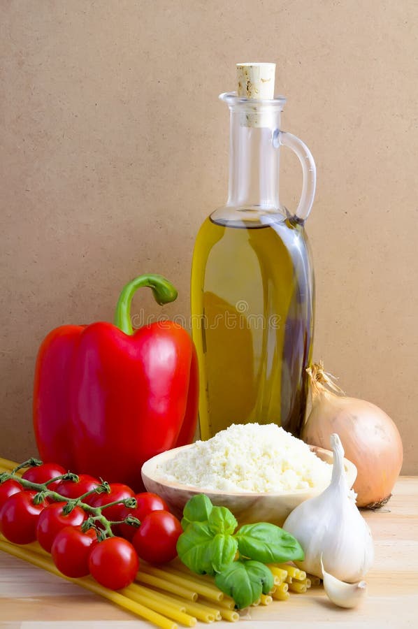 Still life with traditional italian food ingredients on a wooden background. Still life with traditional italian food ingredients on a wooden background