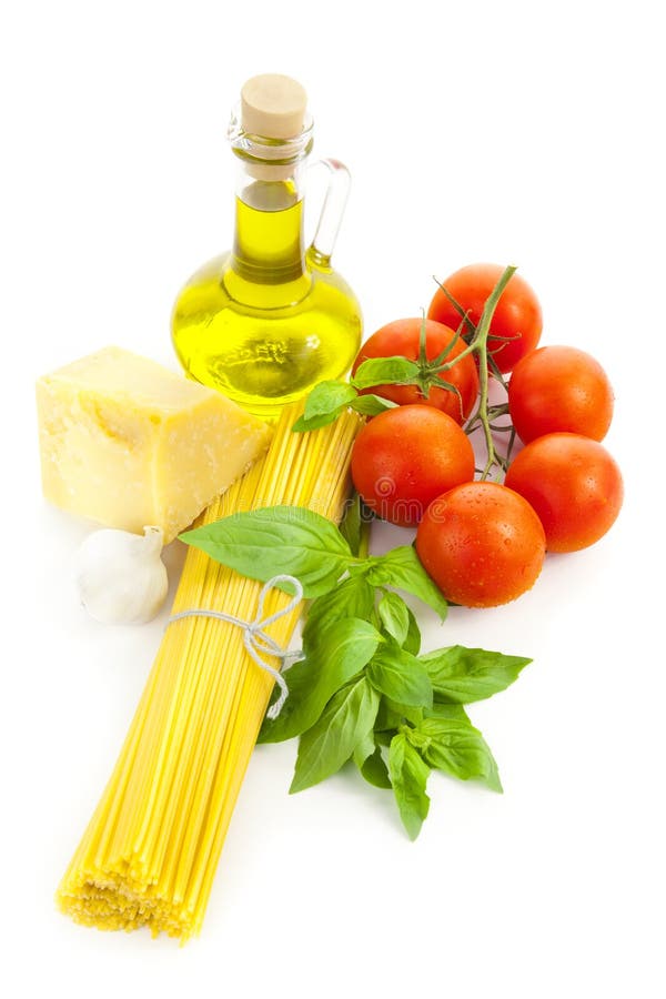 Ingredients for Italian cooking: olive oil, basil, tomato, parmesan, garlic and spaghetti / isolated on white. Ingredients for Italian cooking: olive oil, basil, tomato, parmesan, garlic and spaghetti / isolated on white