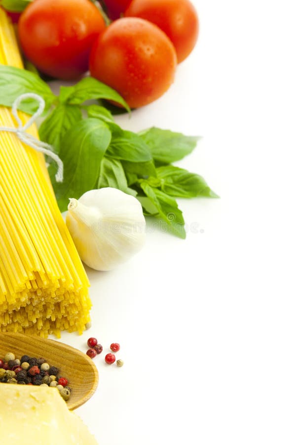 Ingredients for Italian cooking: basil, tomato, parmesan, garlic and spaghetti / isolated on white. Ingredients for Italian cooking: basil, tomato, parmesan, garlic and spaghetti / isolated on white