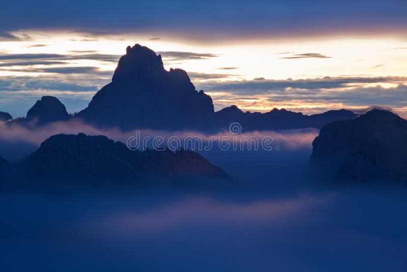 Italy, Dolomites, Alps - wonderful scenery, above the clouds at beautiful day in winter with first snow, Italy.