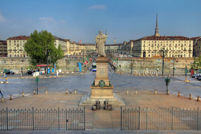 View of the Vittorio Veneto Square in Turin (Torino), Italy from the steps of the Gran Madre di Dio Church. In the foreground the statue of Vittorio Emanuelle I, overlooking the square over Po river. View of the Vittorio Veneto Square in Turin (Torino), Italy from the steps of the Gran Madre di Dio Church. In the foreground the statue of Vittorio Emanuelle I, overlooking the square over Po river.