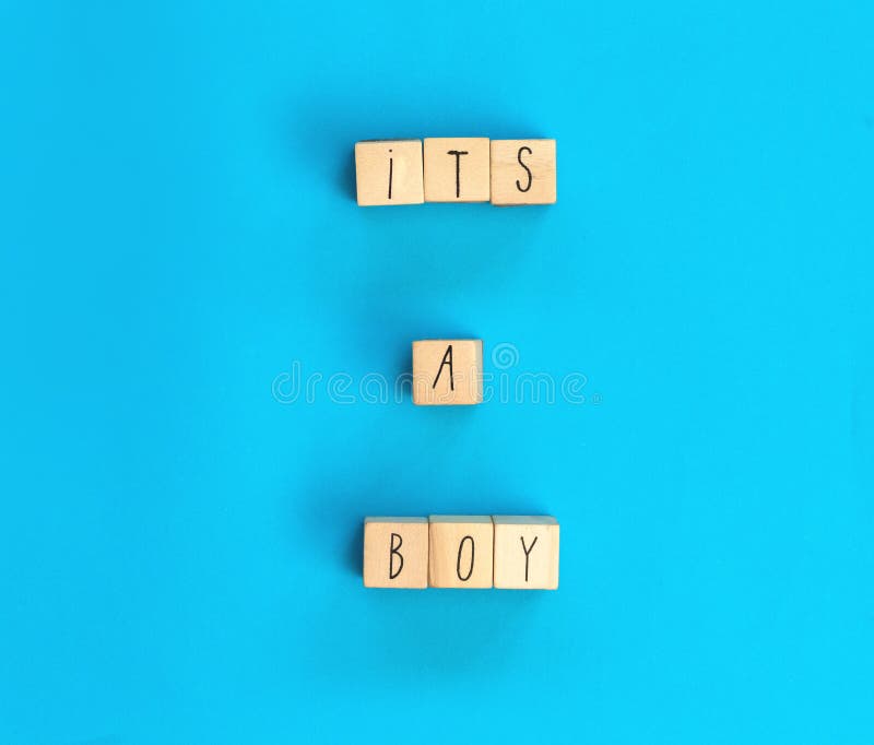 Its a Boy text written with wooden cubes with pastel blue background, Baby Shower or Nursery background Baby announcement. Flat lay,text space. top view copy space, modern concept