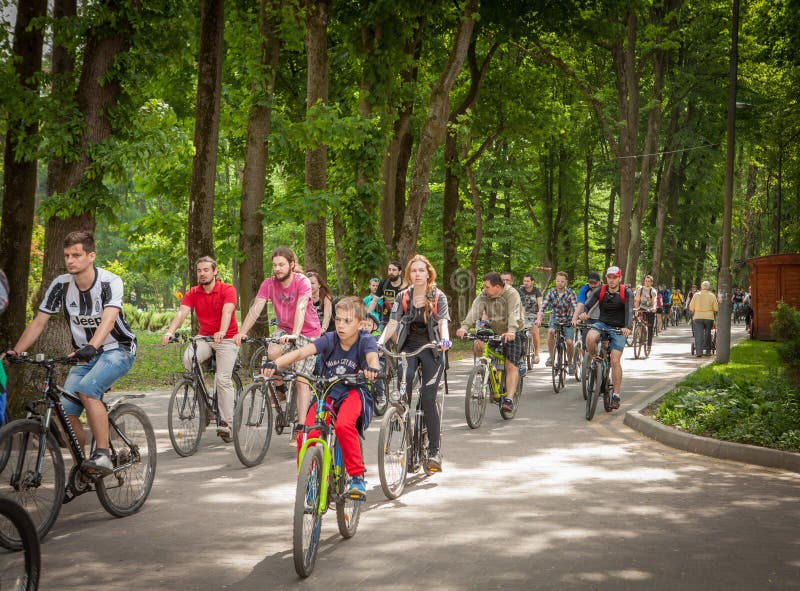 Ivano-Frankivsk, UKRAINE - MAY 5, 2018: Cyclists ride on the streets of city and park. Bike ride to the city day stock photography Ivano-Frankivsk, UKRAINE - MAY 5, 2018: Cyclists ride on the streets of city and park. Bike ride to the city day stock photography