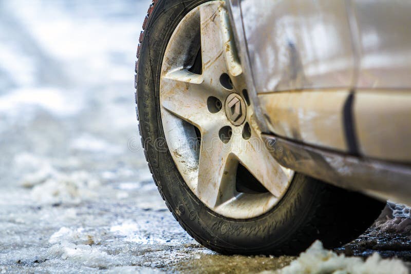 Ivano-Frankivsk, Ukraine - November 22, 2017: Close-up of car wheel in winter tire on snowy road royalty free stock image Ivano-Frankivsk, Ukraine - November 22, 2017: Close-up of car wheel in winter tire on snowy road royalty free stock image