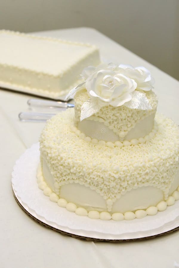A beautiful wedding cake with decoration at wedding reception room for  wedding party. Beautiful Cakes dessert