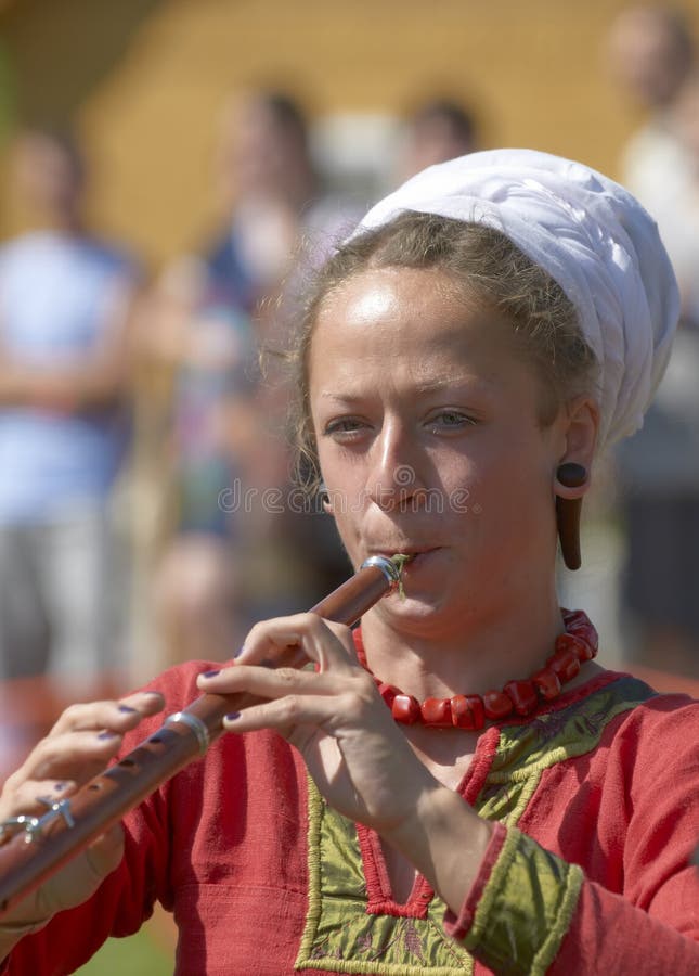 IZBORSK, RUSSIA - AUGUST 6: Unidentified musicians in medieval clothes play ancient musical instruments at festival Iron hailstones on August, 6 2011 in Izborsk, the Pskov area, Russia.