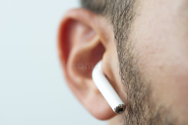 One of the airpods on an ear