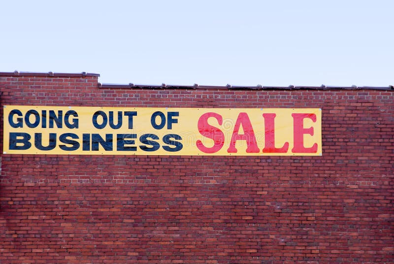 A sign advertising a going out of business sale. A sign advertising a going out of business sale.