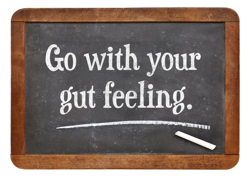 Go with your gut feeling - advice or motivational reminder on a vintage slate blackboard. Go with your gut feeling - advice or motivational reminder on a vintage slate blackboard