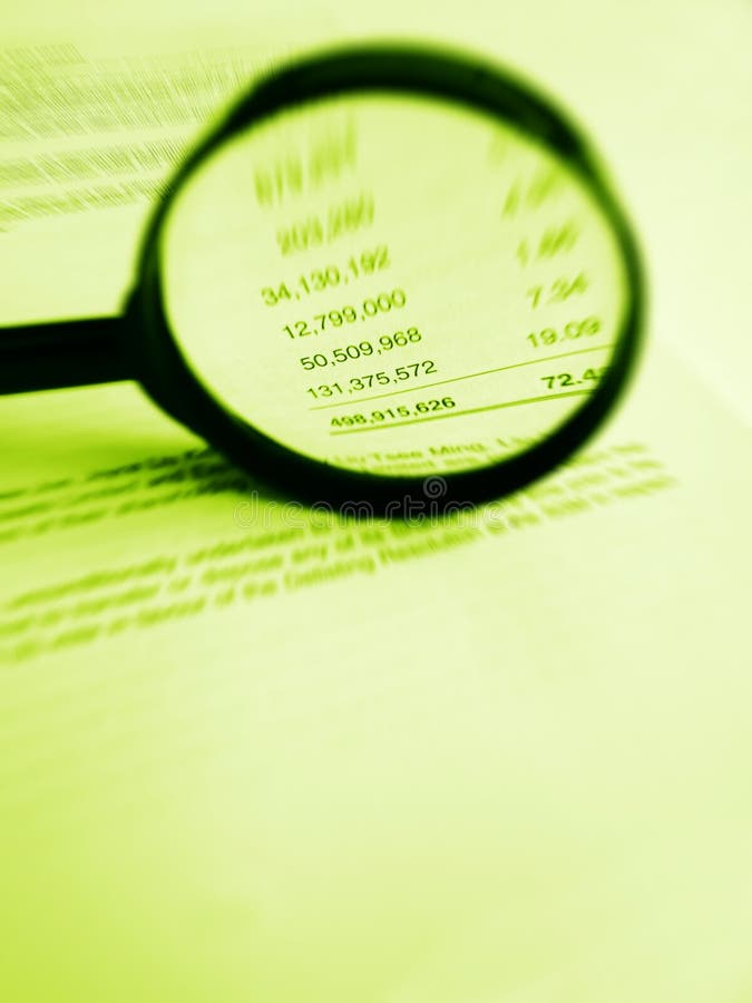 A photograph image of a magnifier focused on numerical figures inside a company annual report for share holders. Vertical monochrome green images, nobody in picture. Simple composition with copy space. Conceptual photography for investment studies, reading annual year reports. A photograph image of a magnifier focused on numerical figures inside a company annual report for share holders. Vertical monochrome green images, nobody in picture. Simple composition with copy space. Conceptual photography for investment studies, reading annual year reports.