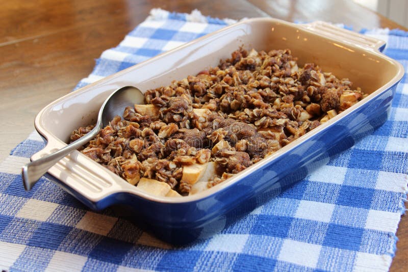 Apple cobbler straight out of the oven in a blue baking dish. Apple cobbler straight out of the oven in a blue baking dish.