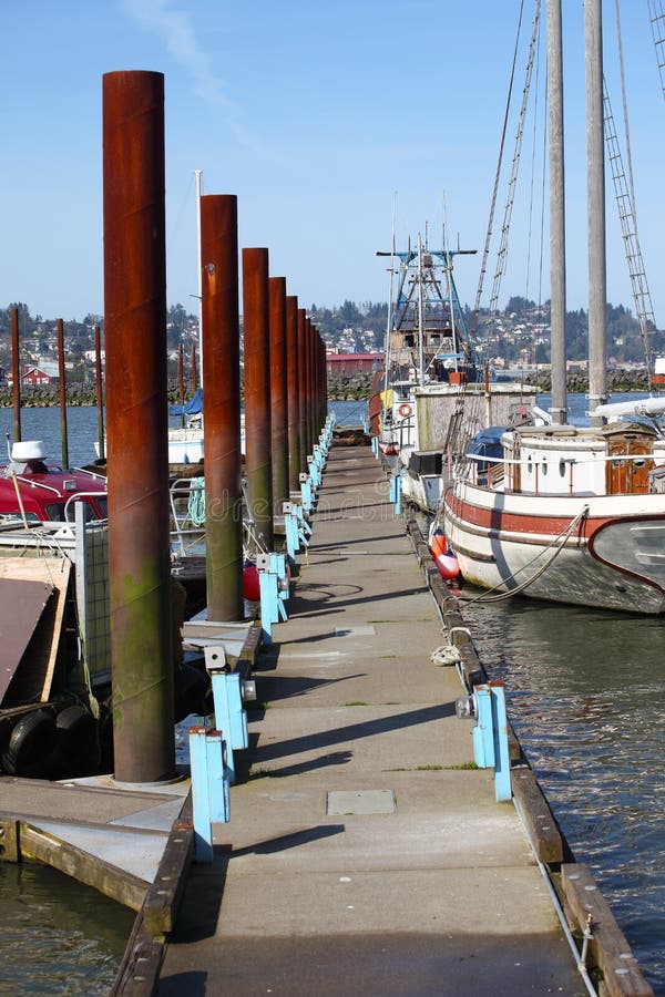 A long platform and steel poles reaches out to accommodate boats and sea-lions, Astoria Oregon. A long platform and steel poles reaches out to accommodate boats and sea-lions, Astoria Oregon.