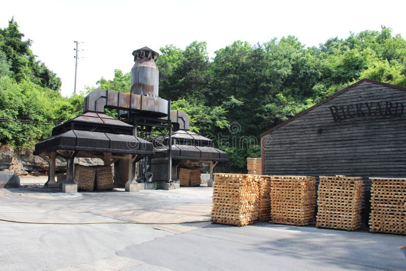 Jack Daniels HQ in Lynchburg Tennessee. Jack Daniel's is a brand of sour mash Tennessee whiskey that is the highest selling American whiskey in the world. It is known for its square bottles and black label. It is produced in Lynchburg, Tennessee by the Jack Daniel Distillery, which has been owned by the Brown-Forman Corporation since 1956. Despite being the location of a major operational distillery, Jack Daniel's home county of Moore is a dry county, so the product is not available for consumption at stores or restaurants within the county. Although the product generally meets the regulatory criteria for classification as a straight bourbon, the company disavows this classification and markets it simply as Tennessee whiskey rather than as Tennessee bourbon. Jack Daniels HQ in Lynchburg Tennessee. Jack Daniel's is a brand of sour mash Tennessee whiskey that is the highest selling American whiskey in the world. It is known for its square bottles and black label. It is produced in Lynchburg, Tennessee by the Jack Daniel Distillery, which has been owned by the Brown-Forman Corporation since 1956. Despite being the location of a major operational distillery, Jack Daniel's home county of Moore is a dry county, so the product is not available for consumption at stores or restaurants within the county. Although the product generally meets the regulatory criteria for classification as a straight bourbon, the company disavows this classification and markets it simply as Tennessee whiskey rather than as Tennessee bourbon.