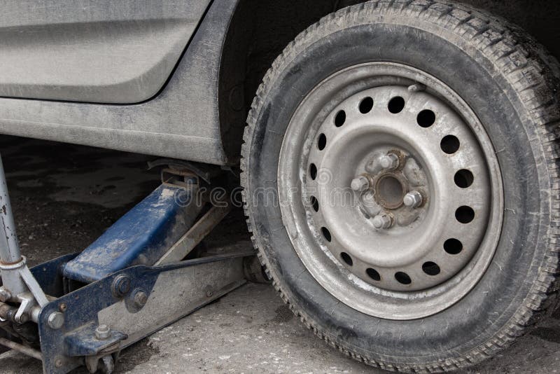 Jack Lifts Car To Replace the Wheels Stock Image Image of technician
