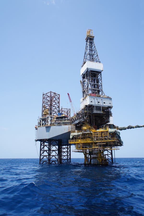 Jack Up Drilling Rig and the Production Platform Stock Photo Image of