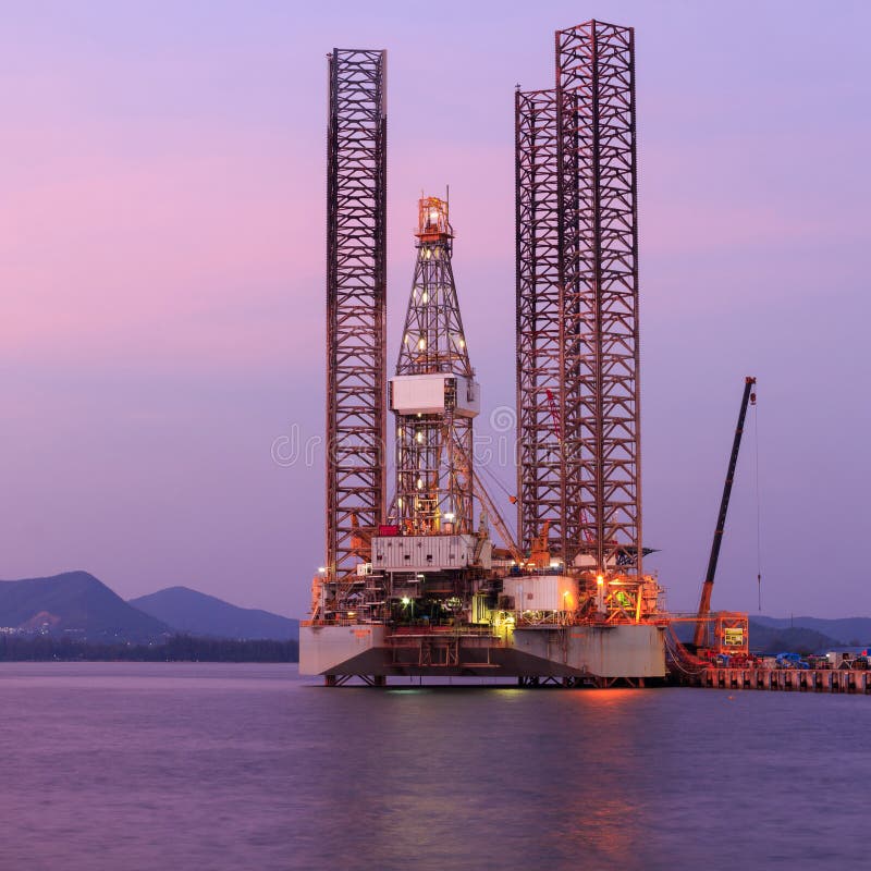 Jack Up Oil Drilling Rig in the Shipyard for Maintenance Stock Photo