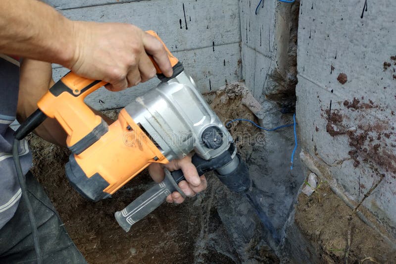 Jackhammer in Action, Pneumatic Construction Tool, Drilling a Hole in the Concrete Wall Stock Image - Image hand, perforator: 210703359