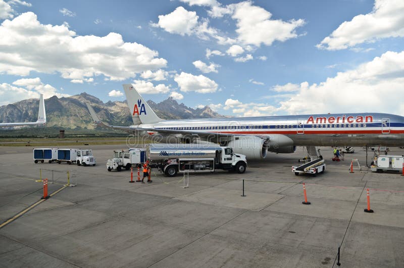 A plane and mountains in the backgrounds in Jackson Hole, Wyoming, USA. A plane and mountains in the backgrounds in Jackson Hole, Wyoming, USA