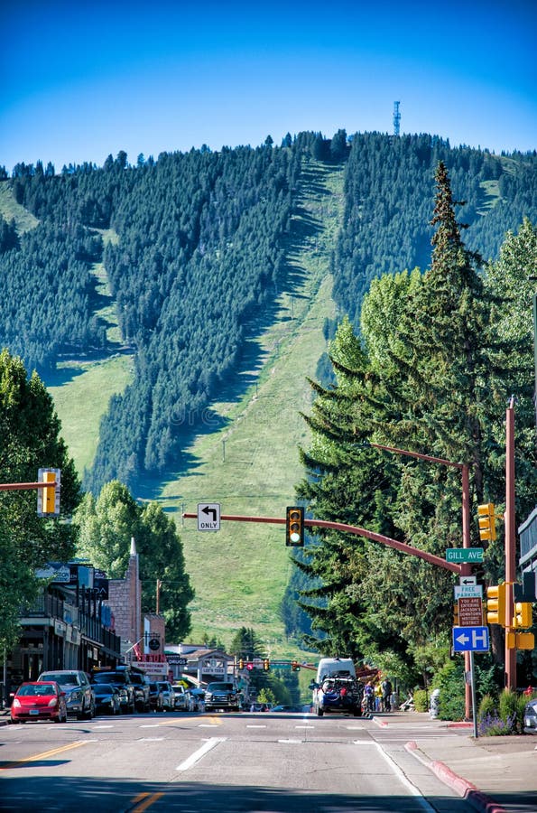 JACKSON HOLE, WY - JULY 11, 2019: Main road with mountains background. The city is the gateway to Grand Teton