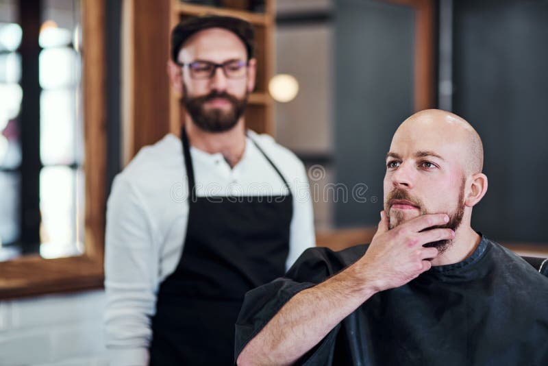 I like the look of that. a handsome young man getting his beard trimmed and lined up at a barbershop. I like the look of that. a handsome young man getting his beard trimmed and lined up at a barbershop