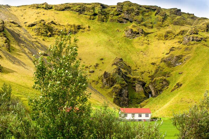 Sunlit mountain Reynisfjall with details of gradual erosion, and the beauty of the environment for living in this part of Iceland