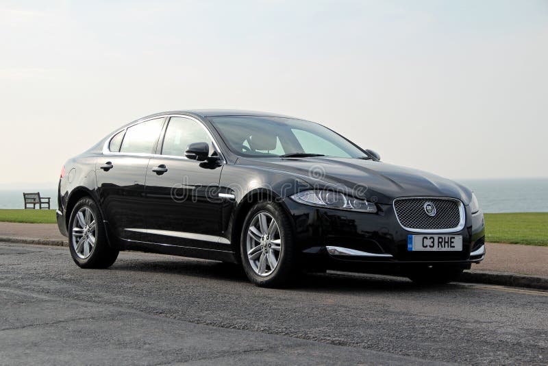 Photo of a black jaguar xf car parked by kerb along the whitstable coast in kent. photo taken 24th april 2015 and ideal for luxury cars,british manufacturing etc. Photo of a black jaguar xf car parked by kerb along the whitstable coast in kent. photo taken 24th april 2015 and ideal for luxury cars,british manufacturing etc.