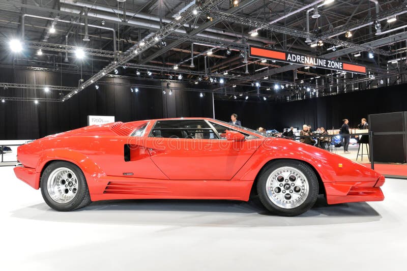 Named to honour the company's twenty-fifth anniversary in 1988, the 25th Anniversary Countach, although mechanically very similar to the 5000QV, sported considerable restyling done by Horacio Pagani. The Lamborghini Countach is a rear mid-engine, rear-wheel-drive sports car produced by the Italian automobile manufacturer Lamborghini from 1974 until 1990. It is one of the many exotic designs developed by Italian design house Bertone, which pioneered and popularized the sharply angled "Italian Wedge" shape. Named to honour the company's twenty-fifth anniversary in 1988, the 25th Anniversary Countach, although mechanically very similar to the 5000QV, sported considerable restyling done by Horacio Pagani. The Lamborghini Countach is a rear mid-engine, rear-wheel-drive sports car produced by the Italian automobile manufacturer Lamborghini from 1974 until 1990. It is one of the many exotic designs developed by Italian design house Bertone, which pioneered and popularized the sharply angled "Italian Wedge" shape.